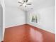 Bright bedroom featuring hardwood floors and a ceiling fan for added comfort at 1869 Appaloosa Mill Ct, Buford, GA 30519