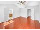 Open bedroom featuring hard wood floors with ensuite bathroom at 1869 Appaloosa Mill Ct, Buford, GA 30519