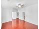 Bedroom with hardwood floors, ceiling fan, and ensuite bathroom at 1869 Appaloosa Mill Ct, Buford, GA 30519