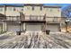 Rear view of townhomes showing garages at 1869 Appaloosa Mill Ct, Buford, GA 30519