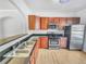 Kitchen featuring sleek stainless steel appliances and ample counter space at 1869 Appaloosa Mill Ct, Buford, GA 30519