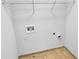 Laundry room area with tile floors and connections for a washer and dryer at 1869 Appaloosa Mill Ct, Buford, GA 30519