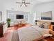 Spacious main bedroom with vaulted ceilings, two windows and hardwood floors at 1869 Appaloosa Mill Ct, Buford, GA 30519