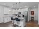 Modern kitchen featuring white cabinets, stainless steel appliances, and a center island with seating at 2422 Mills Bnd, Decatur, GA 30034