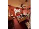 Cozy bedroom with a ceiling fan, bright window, vanity and shelving at 305 Savannah Pl, Douglasville, GA 30134