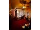 Spacious bedroom featuring a four-poster bed with ceiling fan at 305 Savannah Pl, Douglasville, GA 30134