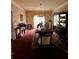 Cozy dining room with a large dining table and a china cabinet at 305 Savannah Pl, Douglasville, GA 30134