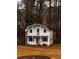 Unique two-story home exterior featuring white siding and a gable roof at 305 Savannah Pl, Douglasville, GA 30134