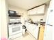 Compact basement kitchen with efficient layout and essential appliances at 3276 Pin Oak Cir, Doraville, GA 30340