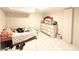 Bedroom with queen bed and white dresser on tile floor at 3276 Pin Oak Cir, Doraville, GA 30340