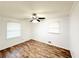 This bedroom features hardwood floors, windows, ceiling fan, and neutral paint at 3276 Pin Oak Cir, Doraville, GA 30340