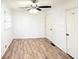 This bedroom features hardwood floors, windows, ceiling fan, and a closet at 3276 Pin Oak Cir, Doraville, GA 30340