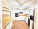 Charming kitchen with open shelving, white cabinets, and ample counter space at 3276 Pin Oak Cir, Doraville, GA 30340