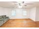 Inviting living room with hardwood floors, neutral walls, and modern ceiling fan at 3276 Pin Oak Cir, Doraville, GA 30340