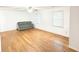 Open-concept living room featuring wood floors and large windows at 3276 Pin Oak Cir, Doraville, GA 30340