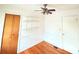 This office area features hardwood floors, windows, and storage shelving at 3276 Pin Oak Cir, Doraville, GA 30340