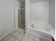 Main bathroom with shower and whirlpool tub at 3677 Utoy Sw Dr, Atlanta, GA 30331