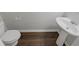 A half bathroom shows the toilet and the sink at 3677 Utoy Sw Dr, Atlanta, GA 30331