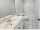 Clean bathroom featuring tile floors, a vanity and a tub-shower combination at 3677 Utoy Sw Dr, Atlanta, GA 30331