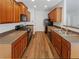 Functional kitchen with wooden cabinets, modern appliances, and plenty of counter space at 3677 Utoy Sw Dr, Atlanta, GA 30331
