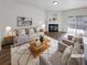 Cozy living room with a fireplace, plush seating, and sliding glass doors to the outside at 3677 Utoy Sw Dr, Atlanta, GA 30331