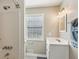Bathroom with white vanity, tile floor and shower with white subway tile at 972 Oakley Ln, Sugar Hill, GA 30518