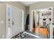 Inviting foyer with tile flooring leading into a bright office space showcasing hardwood floors at 972 Oakley Ln, Sugar Hill, GA 30518