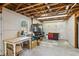 Spacious unfinished garage area with storage space, natural light and a side door at 972 Oakley Ln, Sugar Hill, GA 30518