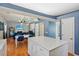 Open floor plan showcasing a kitchen island, dining area, and living room with a fireplace at 972 Oakley Ln, Sugar Hill, GA 30518