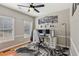 Stylish home office featuring a modern desk setup, hardwood floors, and natural light from two windows at 972 Oakley Ln, Sugar Hill, GA 30518