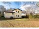 Exterior side view of white home with green backyard at 1388 Willow Sw Trl, Atlanta, GA 30311