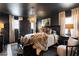 Modern bedroom with a luxurious fur throw blanket, striking decor, and unique pendant lighting at 1388 Willow Sw Trl, Atlanta, GA 30311