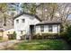 Beautifully landscaped front exterior featuring a modern white home at 1388 Willow Sw Trl, Atlanta, GA 30311