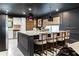 Gourmet kitchen featuring a large island with seating and modern lighting at 1388 Willow Sw Trl, Atlanta, GA 30311