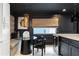 Eat-in kitchen with modern table and chairs, decorative lighting, and elegant finishes at 1388 Willow Sw Trl, Atlanta, GA 30311