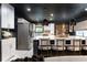 Stylish kitchen with an island with seating and stainless steel appliances at 1388 Willow Sw Trl, Atlanta, GA 30311