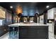 Kitchen island with seating and a wine cooler at 1388 Willow Sw Trl, Atlanta, GA 30311