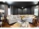 Cozy living room featuring a large sectional sofa and soft lighting at 1388 Willow Sw Trl, Atlanta, GA 30311