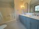Bathroom features double vanity, updated fixtures, and shower/tub combo at 3825 Emerson St, Marietta, GA 30062