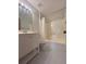 Bright bathroom featuring a white vanity and shower-tub combination at 3825 Emerson St, Marietta, GA 30062