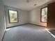 Cozy bedroom with carpet flooring and natural light from two windows at 3825 Emerson St, Marietta, GA 30062