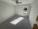 Bedroom with neutral paint, a ceiling fan, a window, and carpeted floor at 3825 Emerson St, Marietta, GA 30062