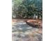 Spacious driveway area bordered by a retaining wall and mature trees at 3825 Emerson St, Marietta, GA 30062