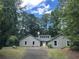 Charming single-story home with a well-manicured lawn and mature trees at 3825 Emerson St, Marietta, GA 30062