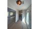 Hallway that leads to the kitchen with light flooring and bright interior paint at 3825 Emerson St, Marietta, GA 30062