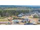 Aerial view of a pool and playground area surrounded by trees and neighborhood houses at 5424 Gallagher Ct, Powder Springs, GA 30127
