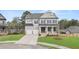 Charming two-story home with a well-manicured lawn, a two-car garage and a welcoming front porch at 5424 Gallagher Ct, Powder Springs, GA 30127