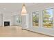 Bright, open living room with a fireplace and plenty of natural light from the many large windows and deck access at 5424 Gallagher Ct, Powder Springs, GA 30127
