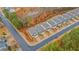 An aerial view of townhomes, showcasing the community layout, landscaping, and street design at 5915 Pinnacle View Rd, Cumming, GA 30040