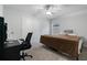 Comfortable bedroom featuring a bed, desk area, closet, and natural light, ideal for rest and productivity at 5915 Pinnacle View Rd, Cumming, GA 30040